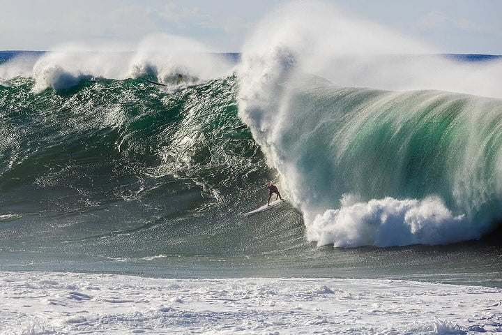 Landon McNamara riding a large wave in his Eddie Aikau victory post